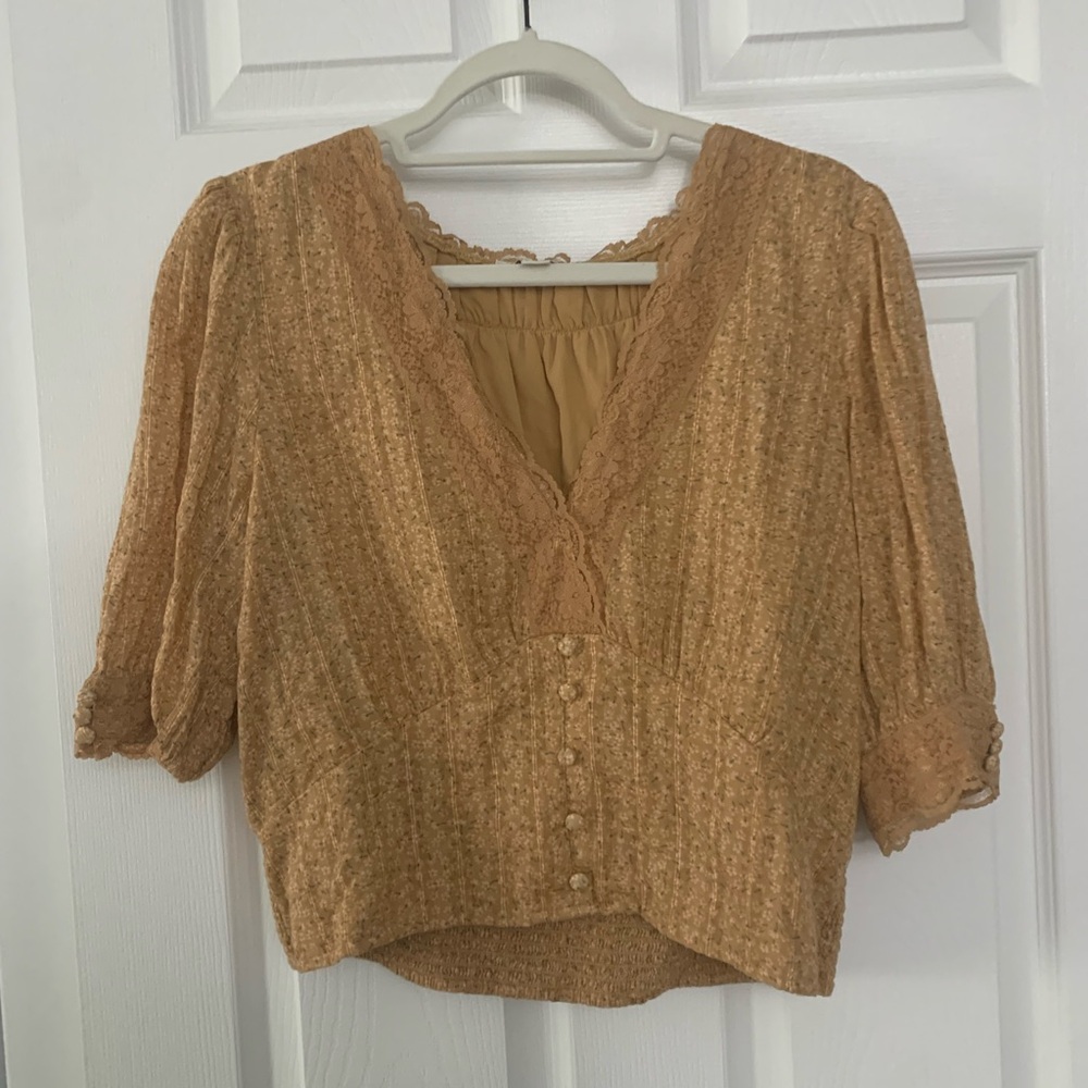 Mustard yellow blouse with lace and button details